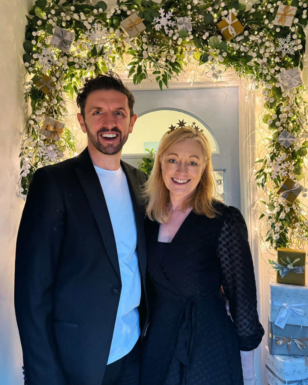 Sophie and Simon Edwards stand at the beautifully decorated doorway of their shop More Than Just A Gift at Narborough Hall