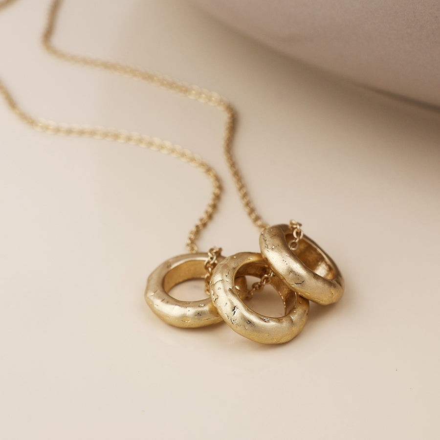 POM Molten Gold-Tone worn triple hoop necklace