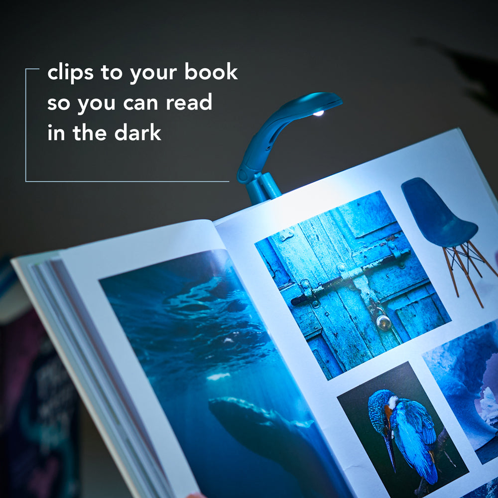 Book with a blue light clip illuminating it, text 'clips to your book so you can read in the dark'.