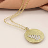 POM Faux gold scratched disc necklace with silver plated fern inlay