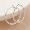 POMSilver plated fancy twist hoop earrings