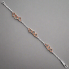 Sterling Silver & Rose Gold Linked Hearts Bracelet