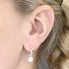 Sterling Silver Two Tone Daisy Charm Huggie Earrings