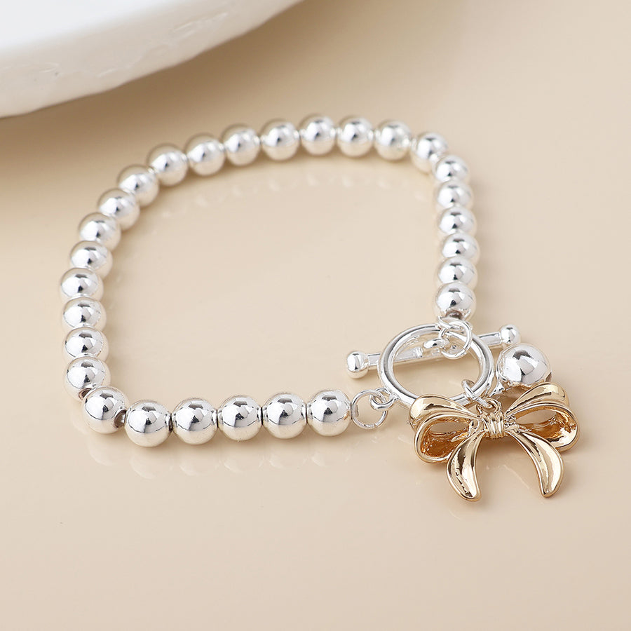 POM Silver Plated Bell & Golden Bow Charm Bracelet - More Than Just a Gift | Narborough Hall