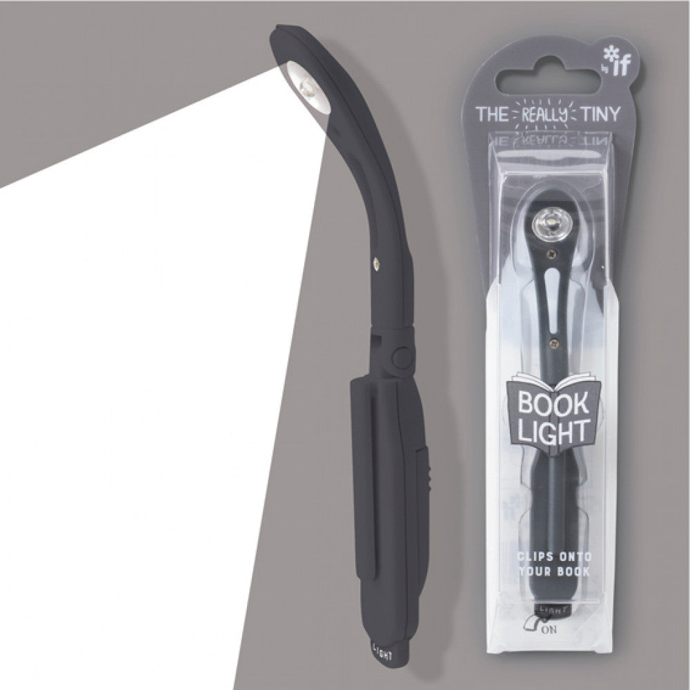 Black book light with packaging labeled 'The Really Tiny Booklight' on a gray background.