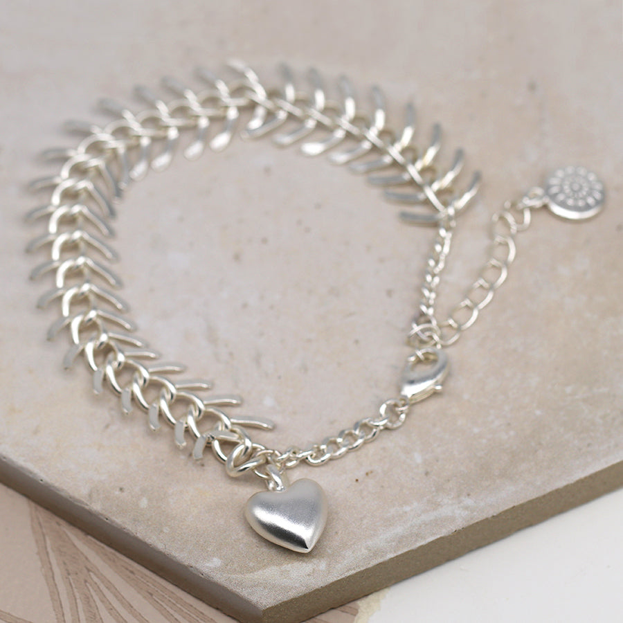 POM Silver Plated Chevron Link Bracelet With Worn Finish And Brushed Heart Charm