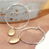 POM Silver Plated Hammerd Hoop And Textured Golden Pebble Charm Earrings